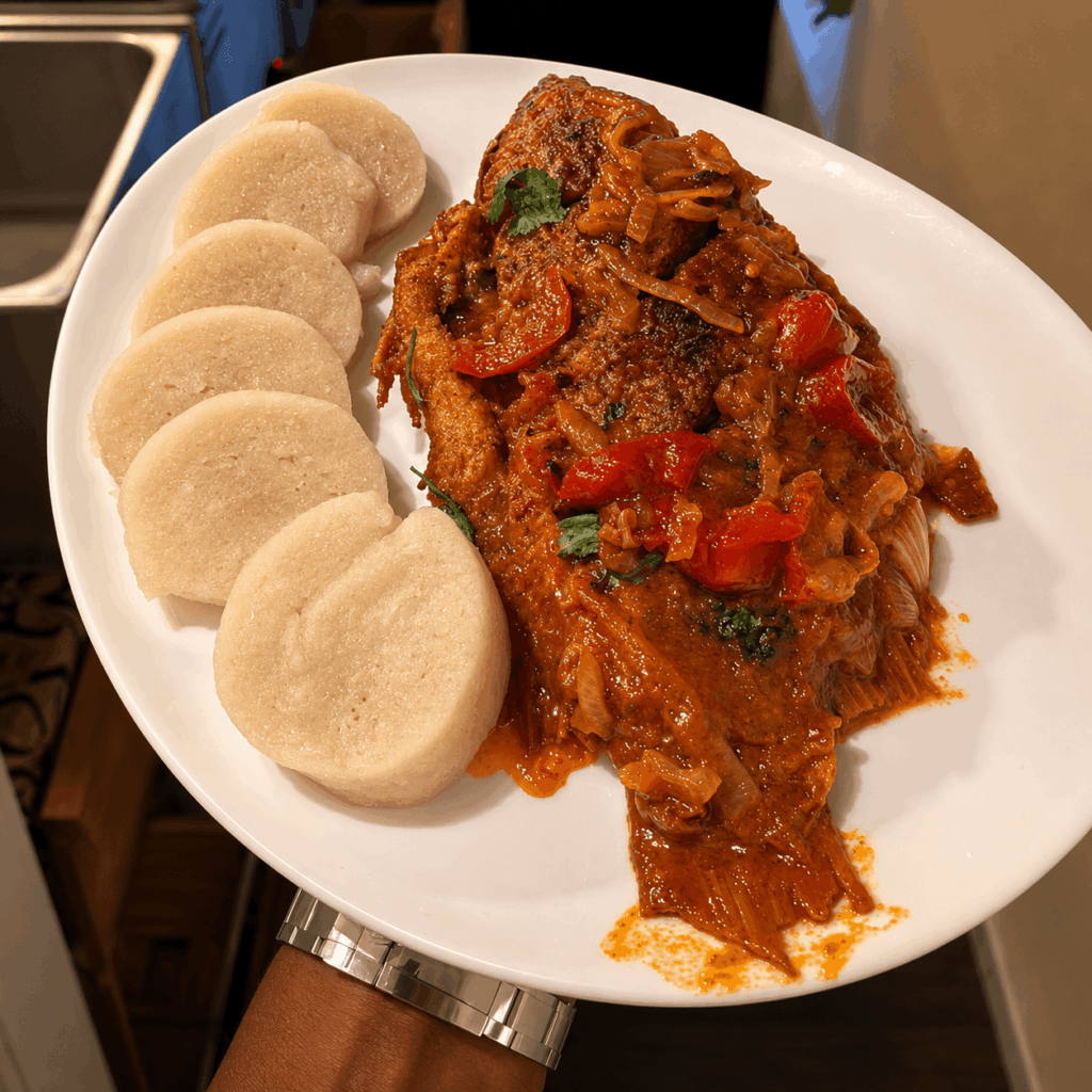 African braised fish cooked in spicy tomato sauce with onions and peppers at Chez Bonaventure Lausanne