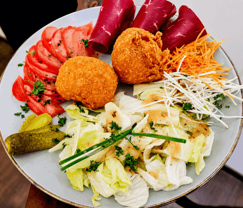 African gourmet dish with salad and homemade specialties at Rio Fresco Geneva