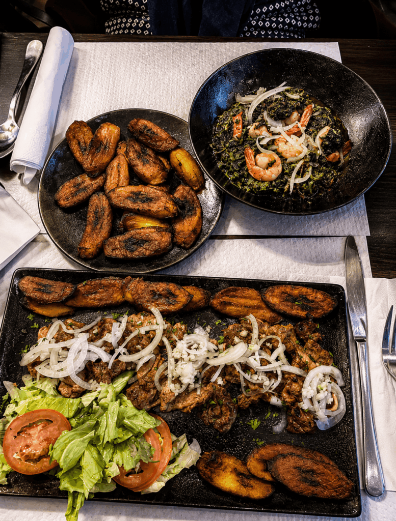 African grilled meat platter with plantains and vegetables at Ébène Lounge Geneva