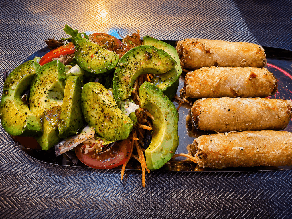 Fresh avocado salad and crispy spring rolls at Rio Fresco du Sénégal Geneva