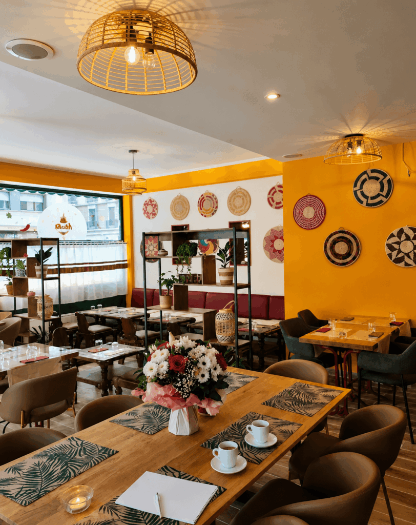 Warm Ethiopian restaurant interior and cultural atmosphere at Awash Geneva