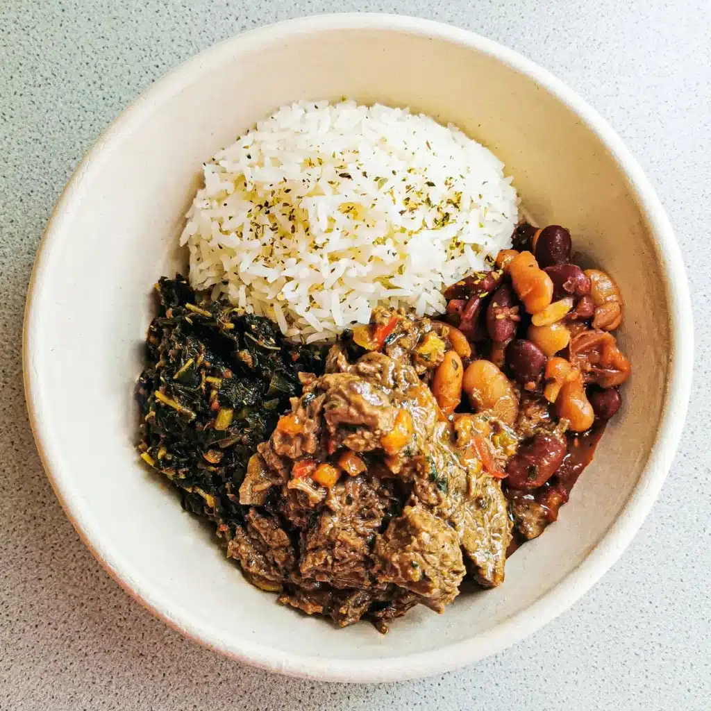 Homemade Congolese beef stew with beans, rice, and African vegetables served at BOMOZIKA restaurant in Zürich