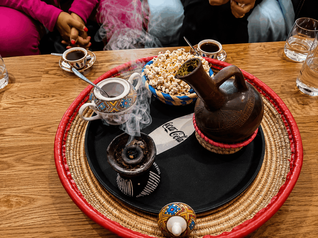 Traditional Ethiopian coffee ceremony with jebena coffee pot and popcorn at Savanna Coffee & Food in St. Gallen