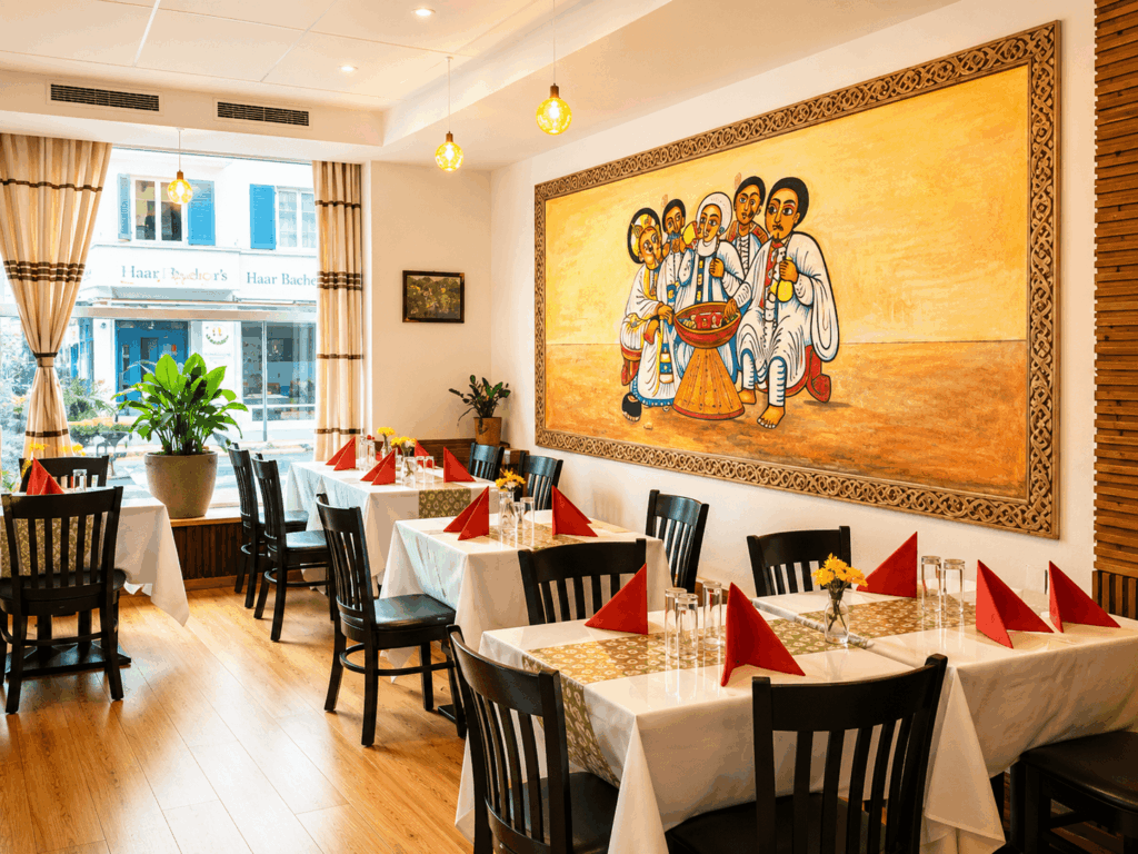 Traditional Ethiopian artwork and cozy dining space inside Gebeta Restaurant in Basel