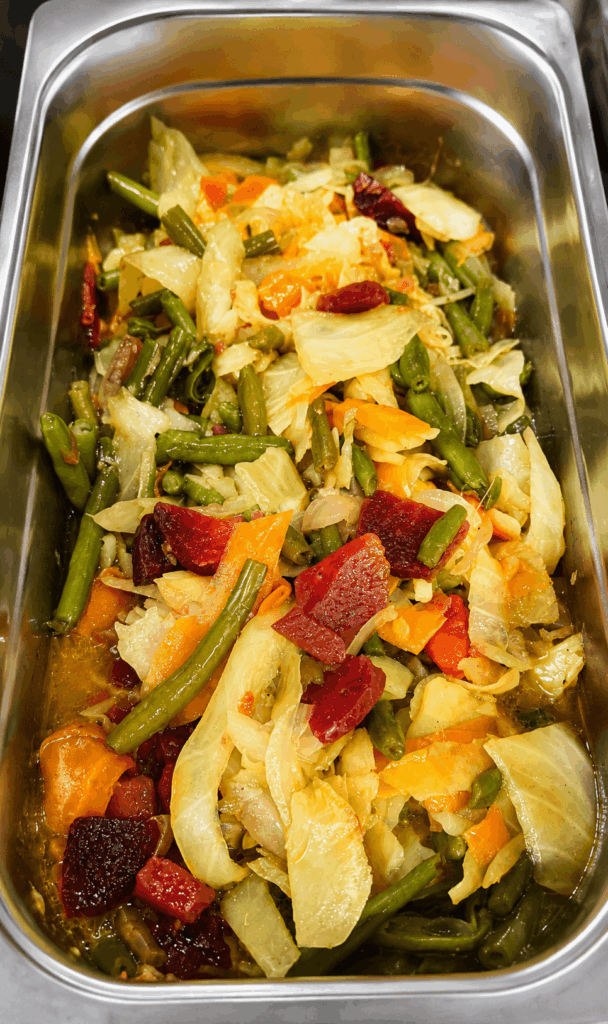 Homemade Ethiopian and Eritrean mixed vegetable dish with cabbage, carrots, beans, and beetroot at Injera Restaurant