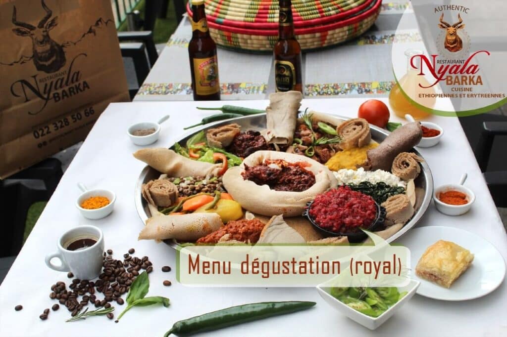 Traditional Ethiopian injera sharing platter at Nyala Barka Geneva