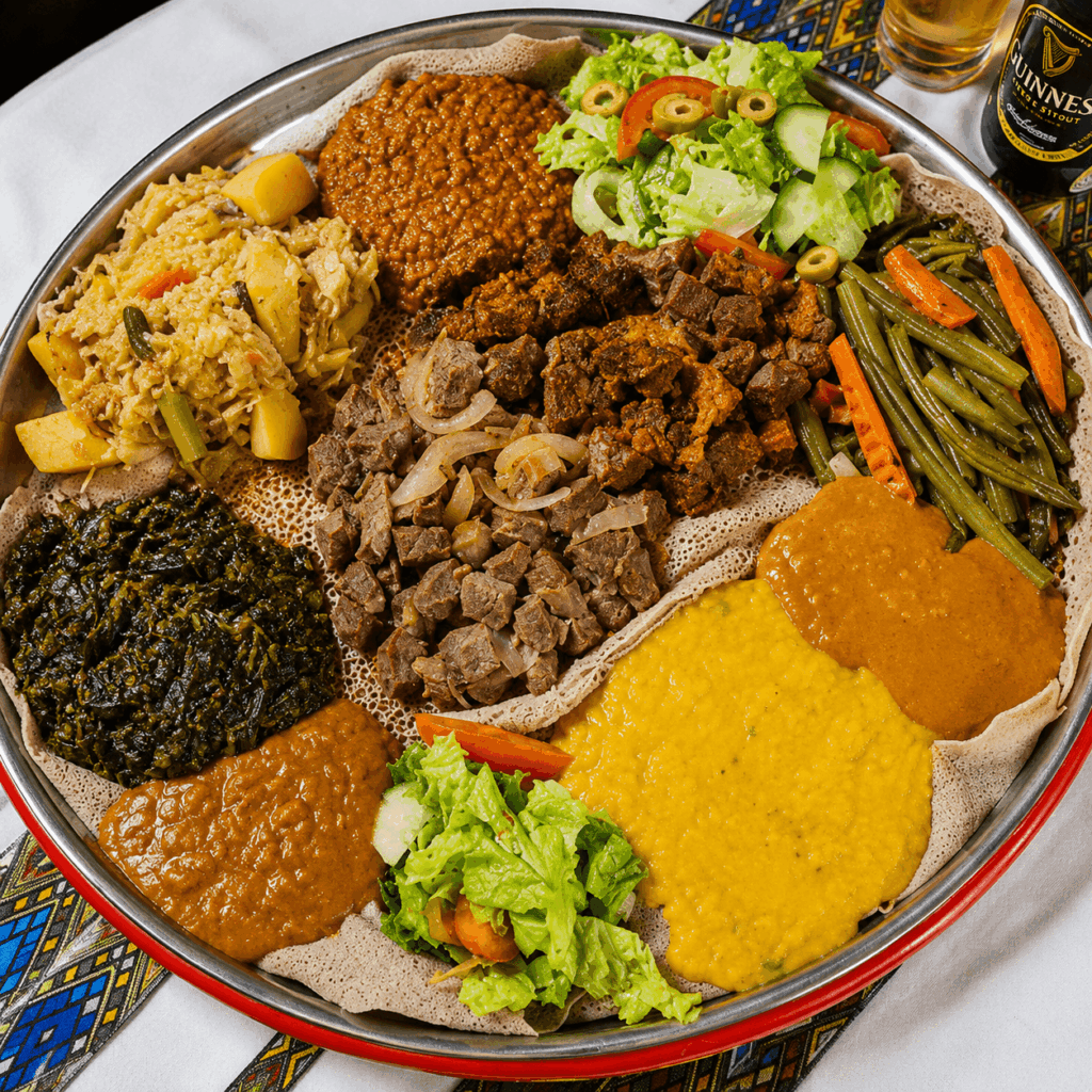 Ethiopian vegetarian platter with lentils, cabbage, spinach, and injera at Senay Restaurant Aarau