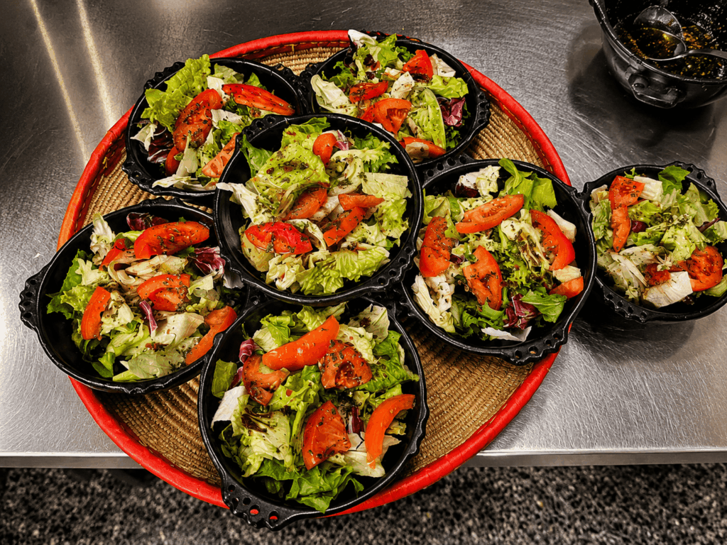 Fresh homemade African salad prepared with tomatoes and green vegetables at Savanna Coffee & Food St. Gallen