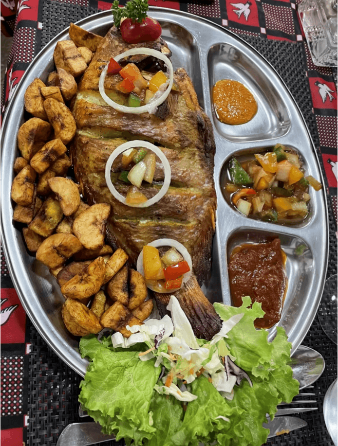 Traditional grilled fish served with African cuisine at La Couronne d’Or Geneva