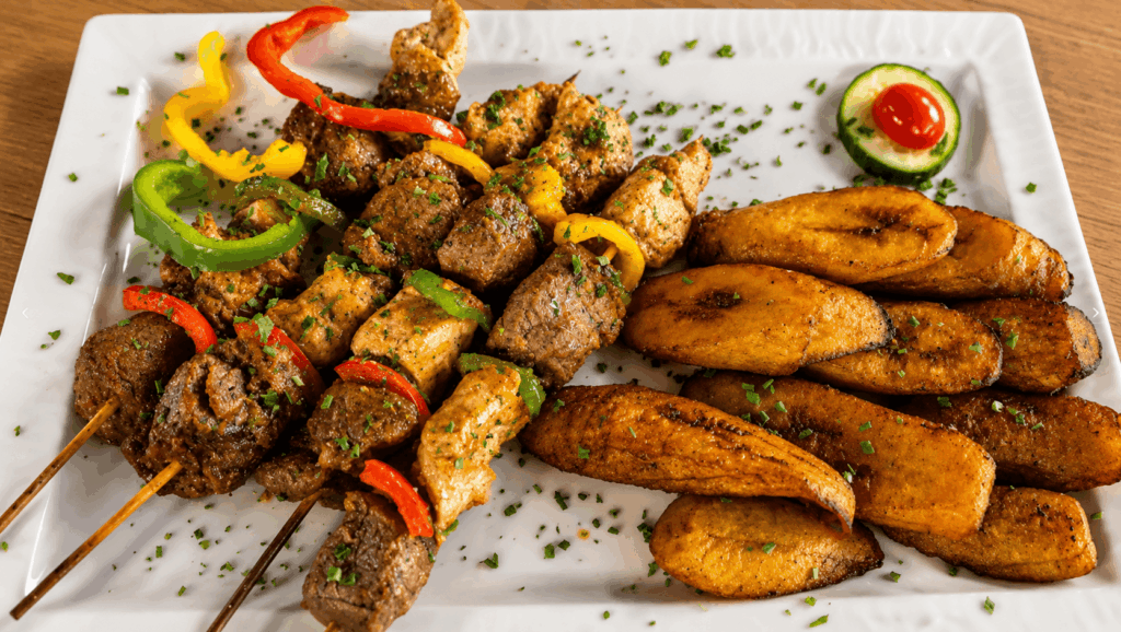 Grilled chicken served with fried plantains at Rio Fresco du Sénégal Geneva