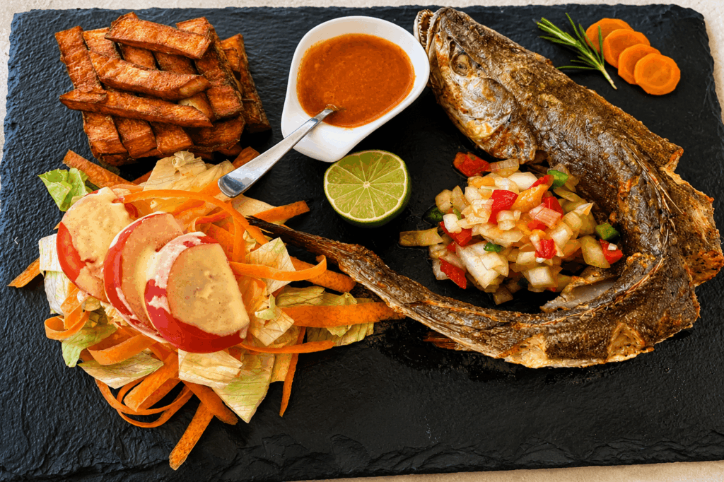 African-style grilled fish with plantains and salad at Ébène Lounge Geneva