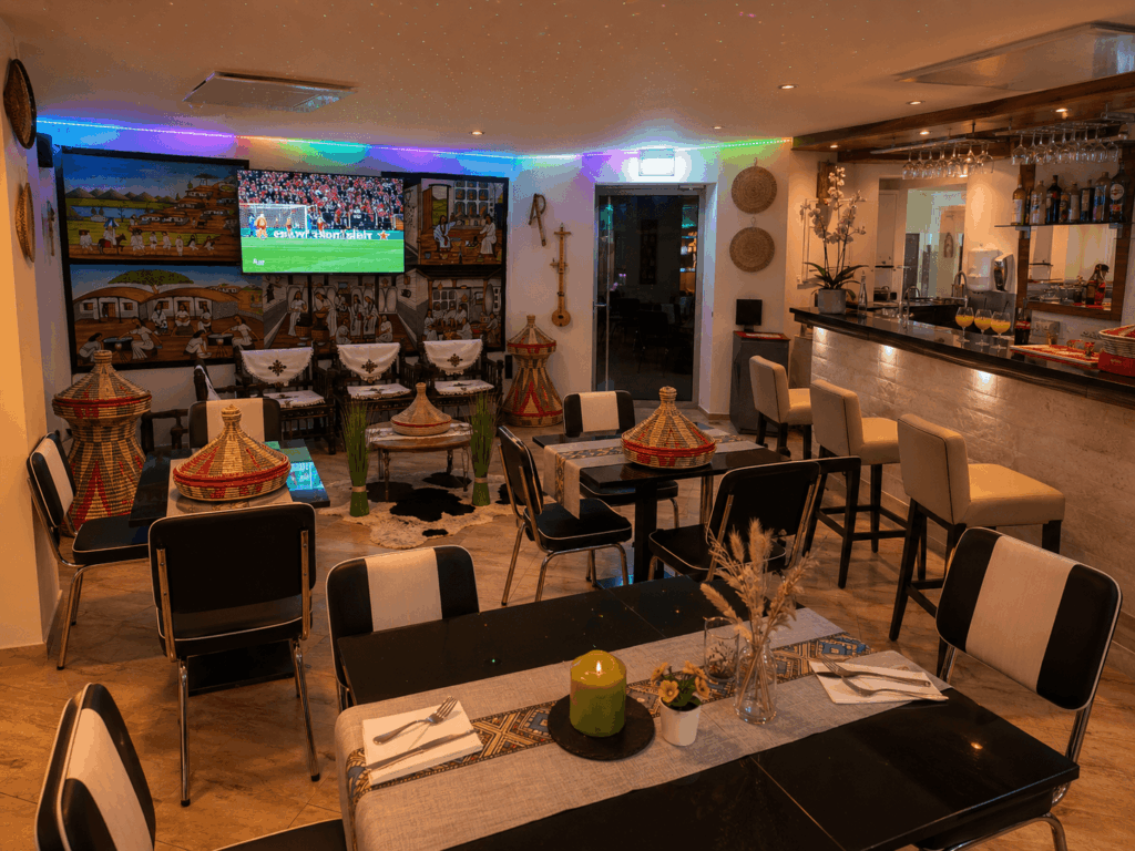 Modern Eritrean lounge restaurant interior with traditional Habesha décor and dining atmosphere in Switzerland