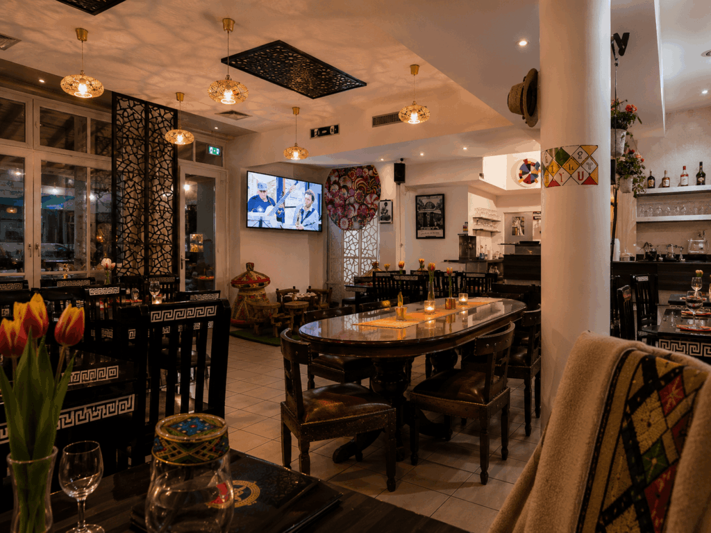 Warm and welcoming interior of Liyu Ethiopian Restaurant in Zürich with traditional East African decor and dining atmosphere