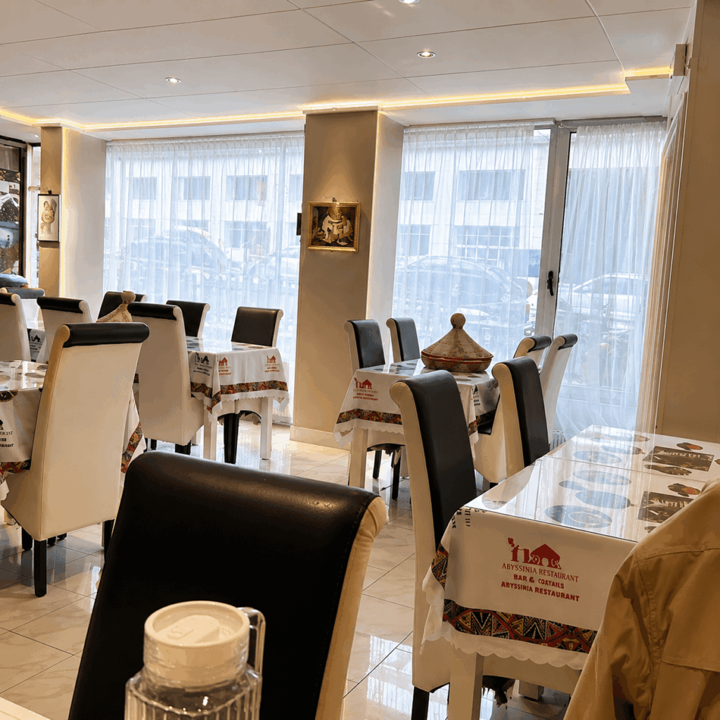 Elegant dining room at Mama Cuisine Habesha Ethiopian and Eritrean restaurant in Lausanne featuring bright seating and a welcoming atmosphere