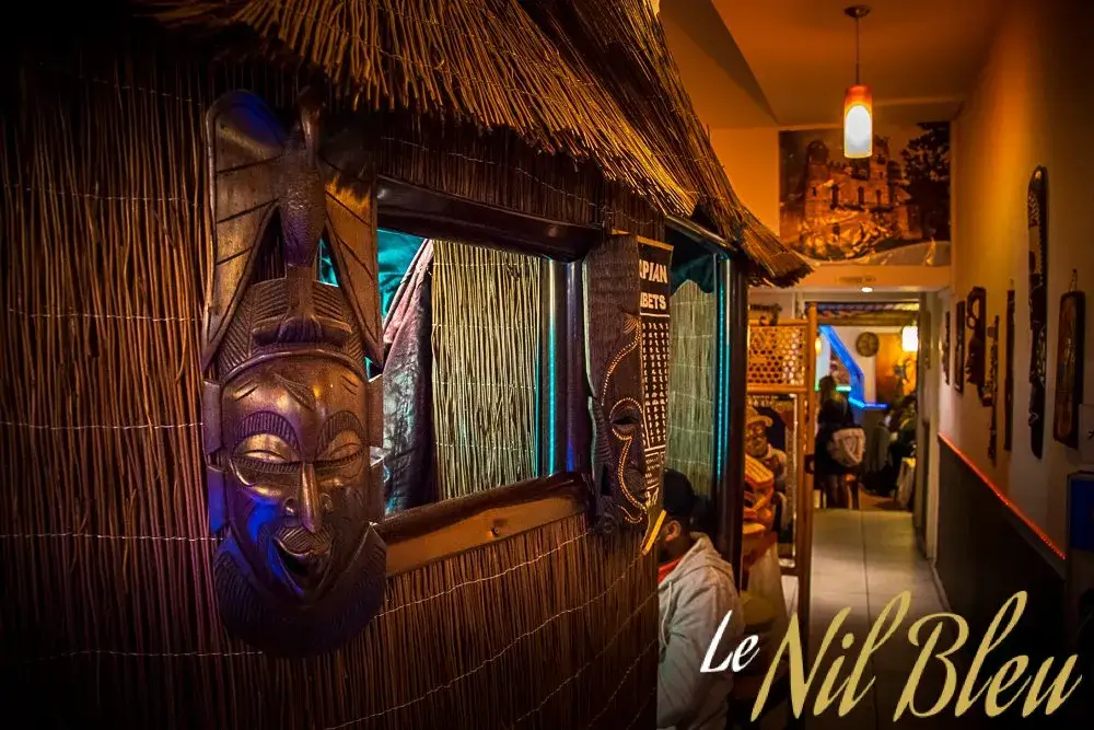 Warm African-inspired interior and cultural decoration inside Nil Bleu Ethiopian restaurant in Lausanne Switzerland