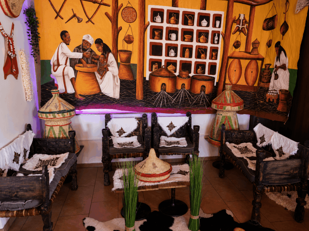 Traditional Habesha-inspired seating area and Eritrean cultural decoration at Raena restaurant in Lucerne