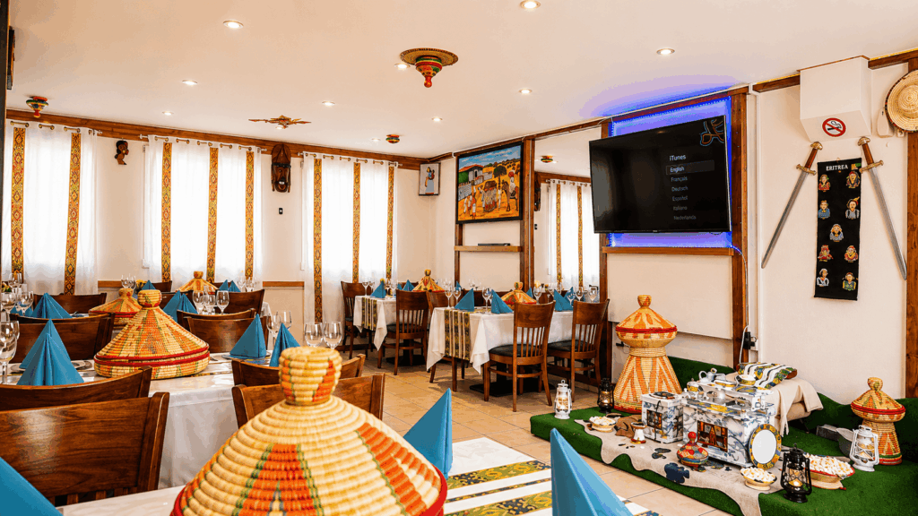 Interior dining area of Red Sea Restaurant Habesha in St. Gallen with authentic Eritrean and Ethiopian decor