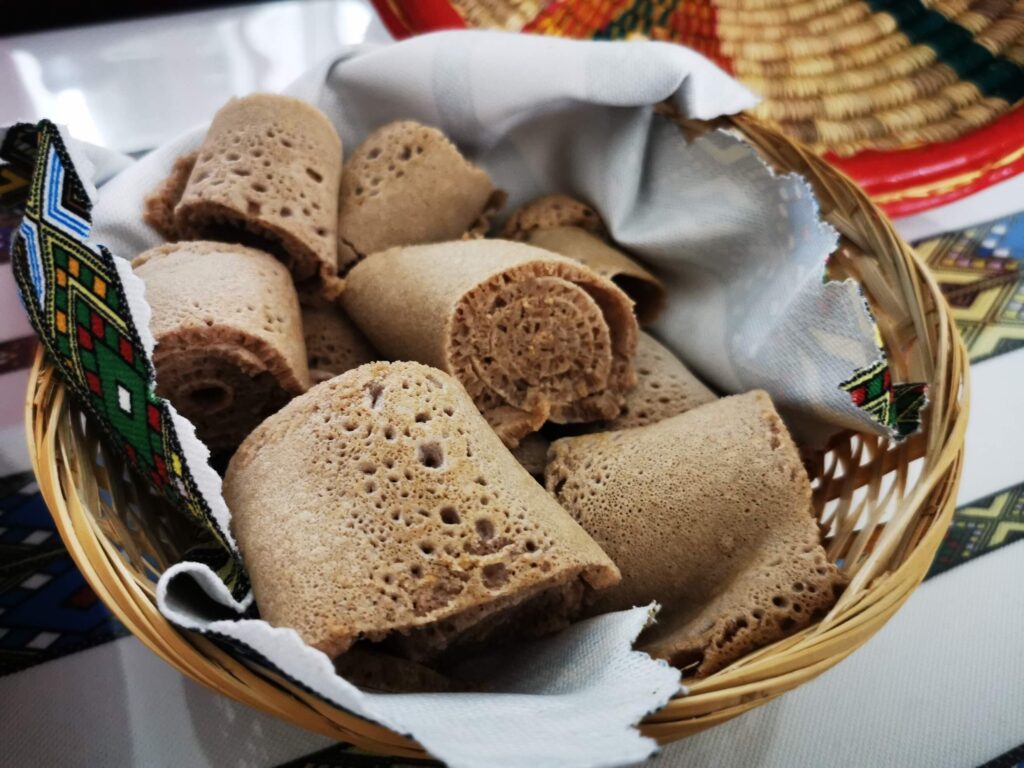 Rolled injera bread served in a traditional basket at Red Sea Restaurant Habesha