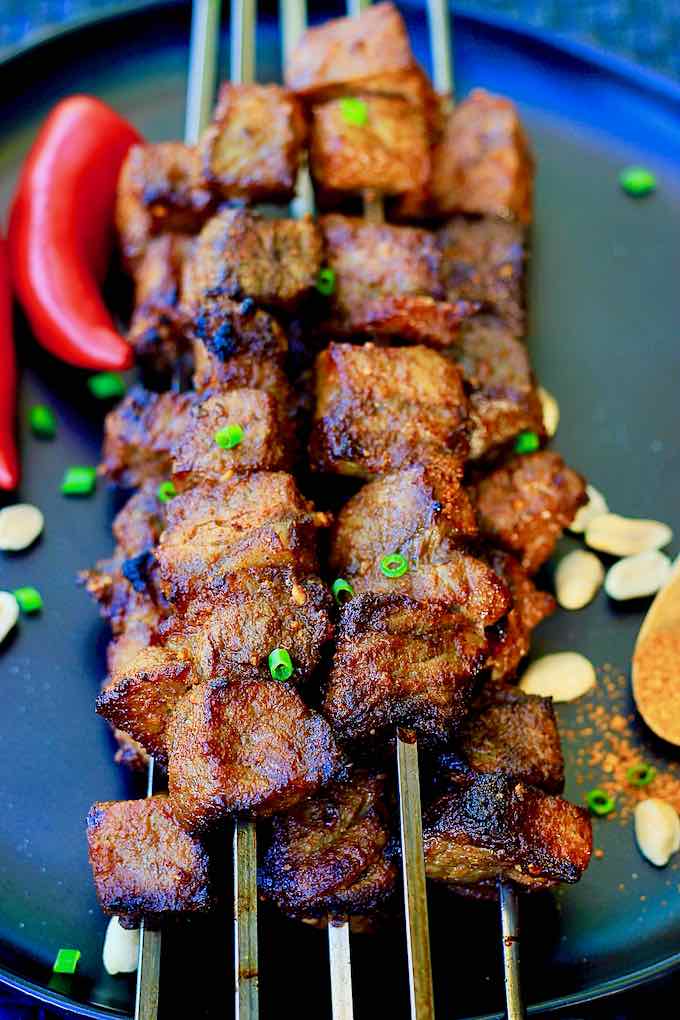 Spicy African Suya beef skewers grilled with authentic West African seasonings and served at Seleyah Restaurant Geneva