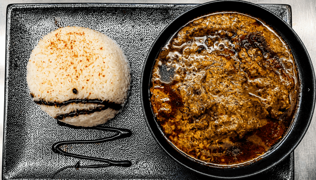 Authentic Senegalese beef stew served with white rice at Le Palmarin restaurant