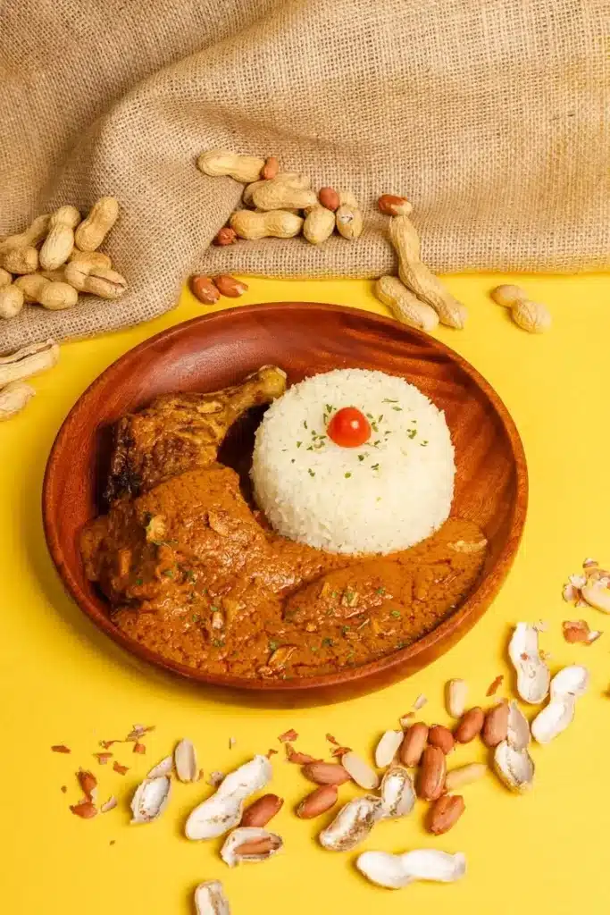 Traditional Senegalese mafé with peanut sauce, rice, and grilled chicken at Afrogood Lausanne