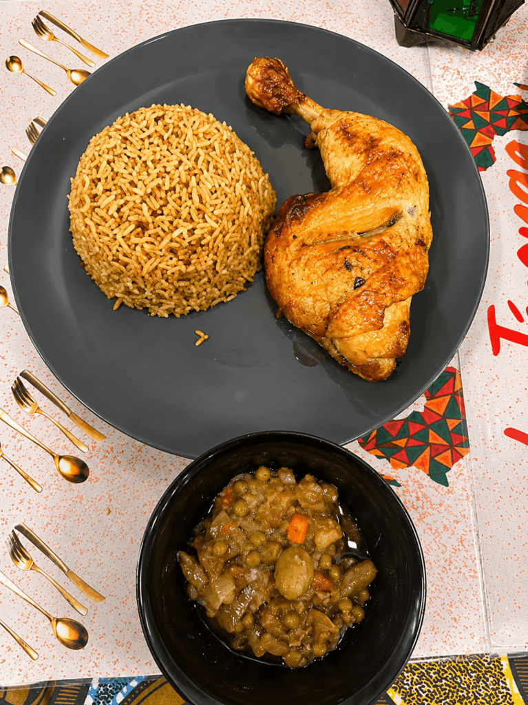 Roasted chicken served with seasoned rice and vegetables at La Teranga restaurant Geneva
