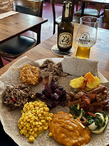 Authentic injera served with homemade Ethiopian and Eritrean specialties, showcasing traditional East African flavors at Shiro Basel
