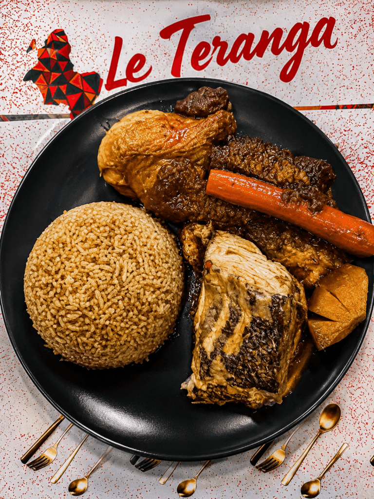 Traditional Senegalese thieboudienne with fish, rice, vegetables, and meat at La Teranga Geneva