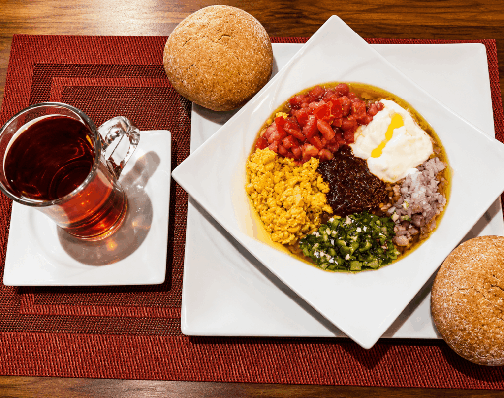 Ethiopian vegetarian specialties with lentils, spinach, cabbage, and injera served at Lalibela Restaurant in Switzerland