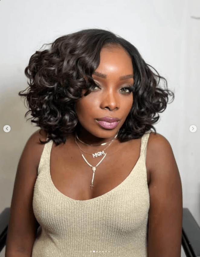 Client with finished afro hair extensions at Ultra Beauty salon in Geneva