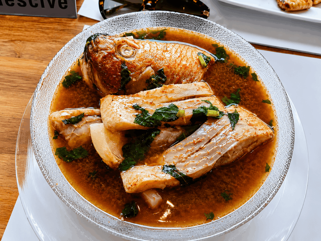 Traditional Nigerian Pepper Soup prepared with tender meat, aromatic spices, and authentic West African flavors at Queen Idia Restaurant Zürich